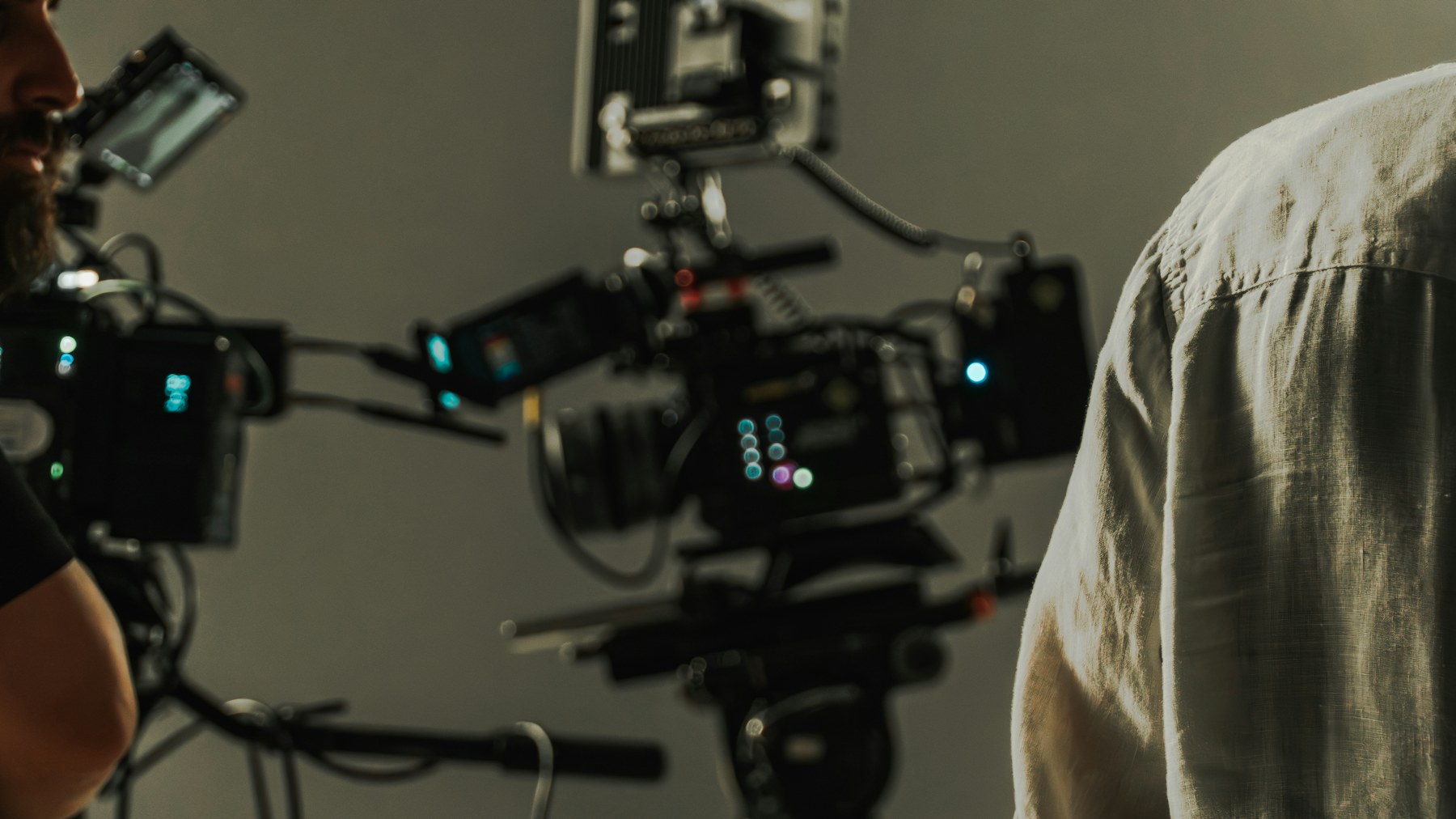 Film crew and cinema cameras preparing a studio shot.