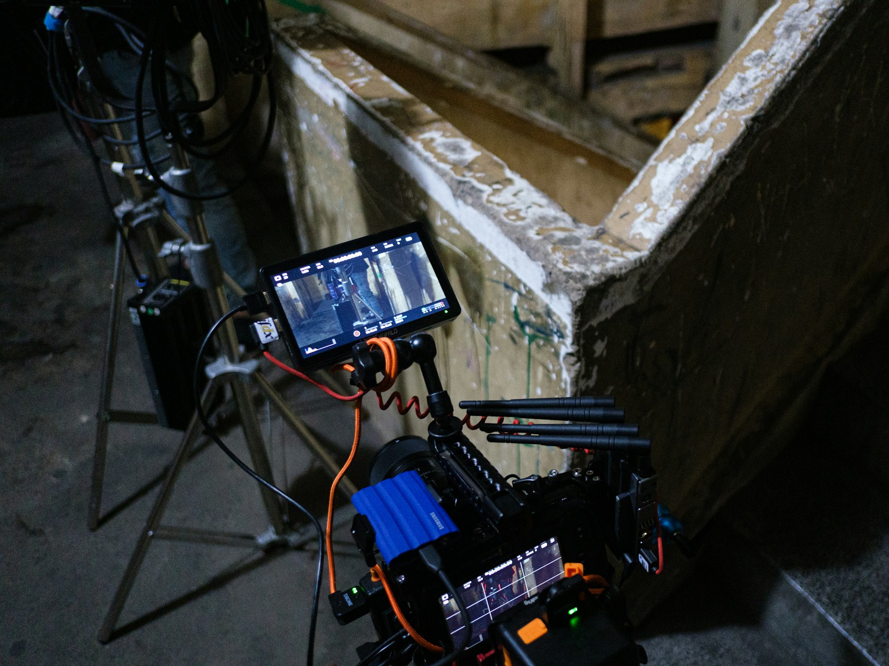 A cinema camera rig with a production monitor on set.